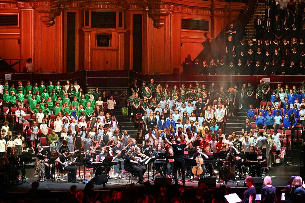 Choirs and musicians perform at the Royal Albert Hall.